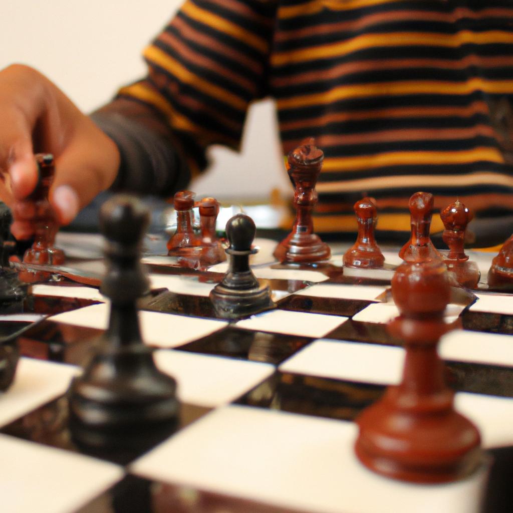 Person playing chess with focus